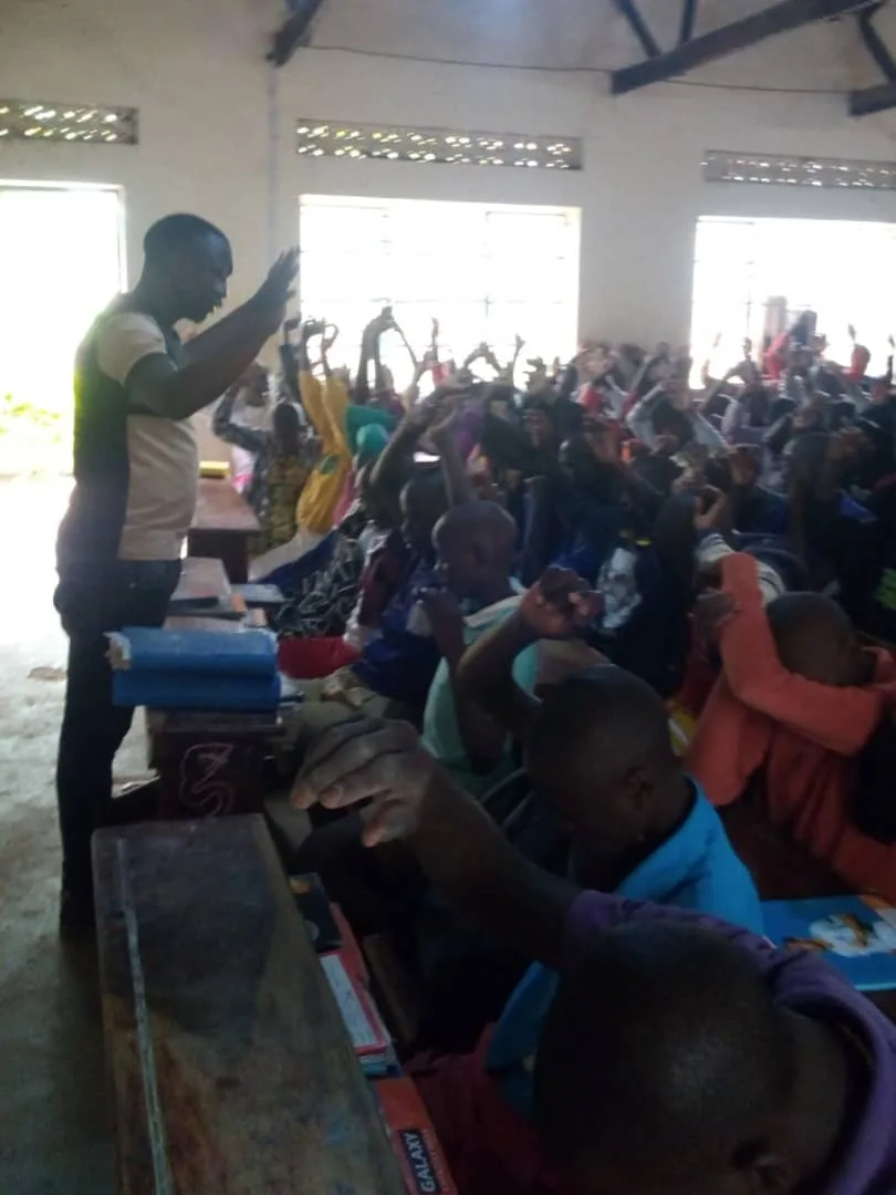 Facilitator speaking to youth during a classroom session