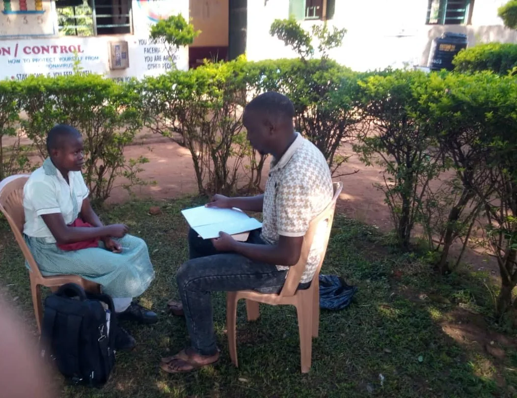Team member meeting a sponsored child at school