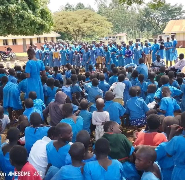 Large gathering of students during a school outreach