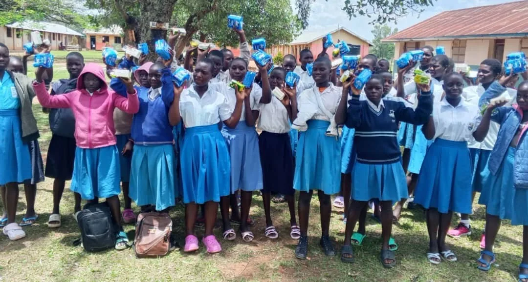 Schoolgirls receiving sanitary kits